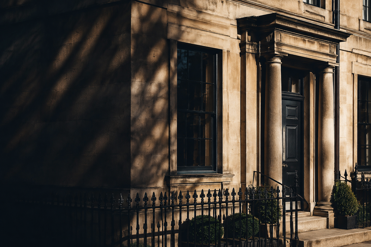 Stone townhouse in late-afternoon light